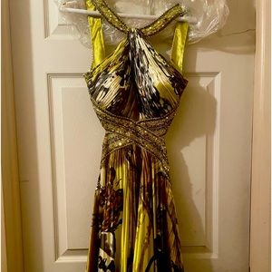 Multi colored prom dress by Jovani size 8. Peach dress by Hailey Logan size 3/4